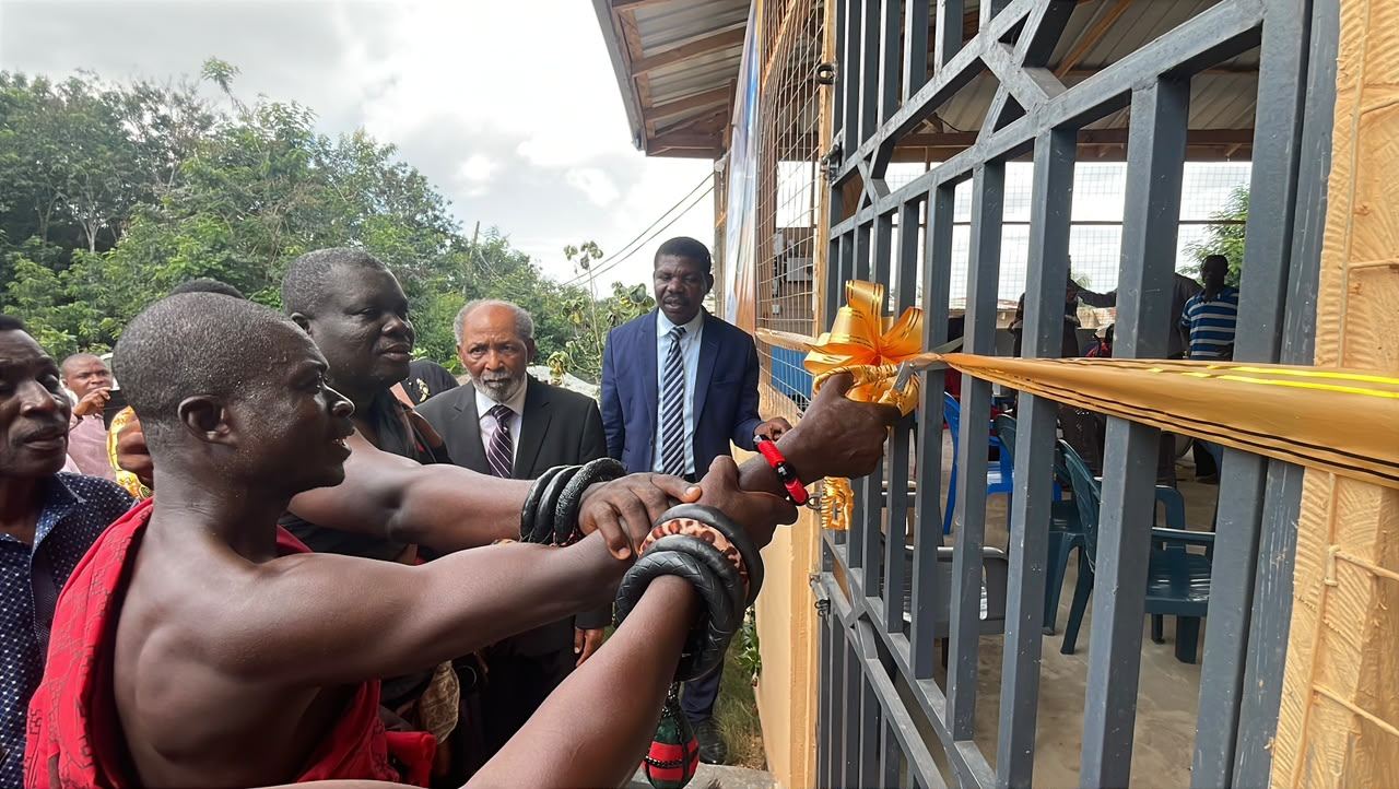 Chiefs and dignitaries cutting the ribbon at the factory gate during the inauguration.